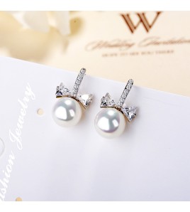 SATN122E100395 S925純銀女生簡約貝珠蝴蝶結珍珠耳釘韓版氣質甜美耳飾代發